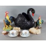 A Dartmouth model of a swan together with other ceramics to include two teabowls and saucers from