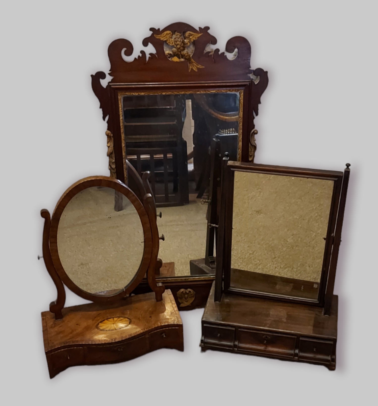 A 19th Century swing frame toilet mirror with three drawer base together with another similar
