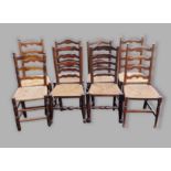 A harlequin set of eight elm ladder back dining chairs, each with a rush seat raised upon turned