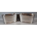 A pair of Champagne coolers, each bearing Bollinger inscription, 30cms x 14cms