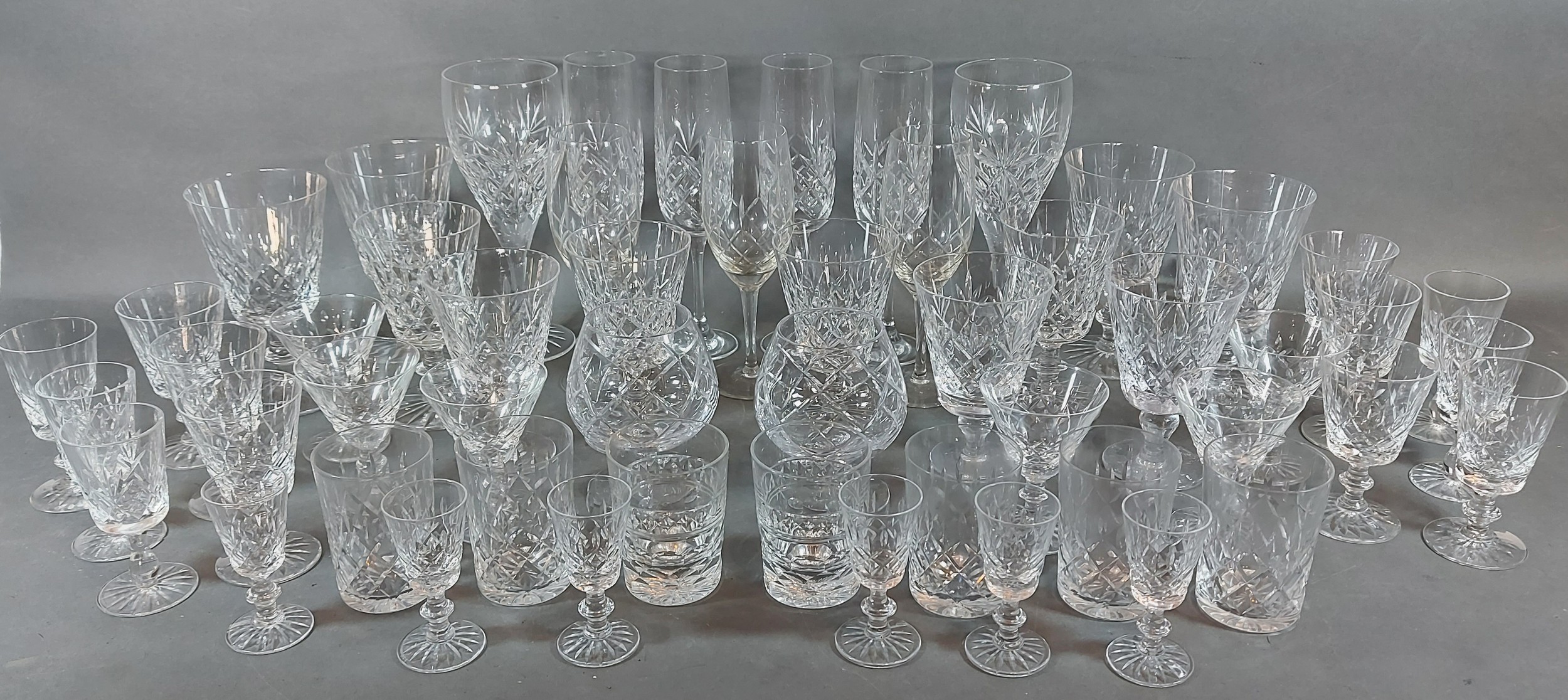 A cut glass drinking set, together with other drinking glasses