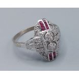 A 9ct white gold diamond and ruby ring the Art Deco style, ring size Q, 3.7grams