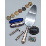 A seven cameo bracelet together with two brooches, a cased M.O.P. and silver fruit knife, two