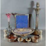 A silver plated Corinthian column table lamp together with a Cranberry spill vase and other items of