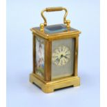 A Miniature Brass Cased Carriage Clock with sevres style panels and silvered dial with lever