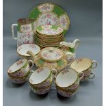 A Mintons porcelain tea service, comprising teapot, cups and saucers