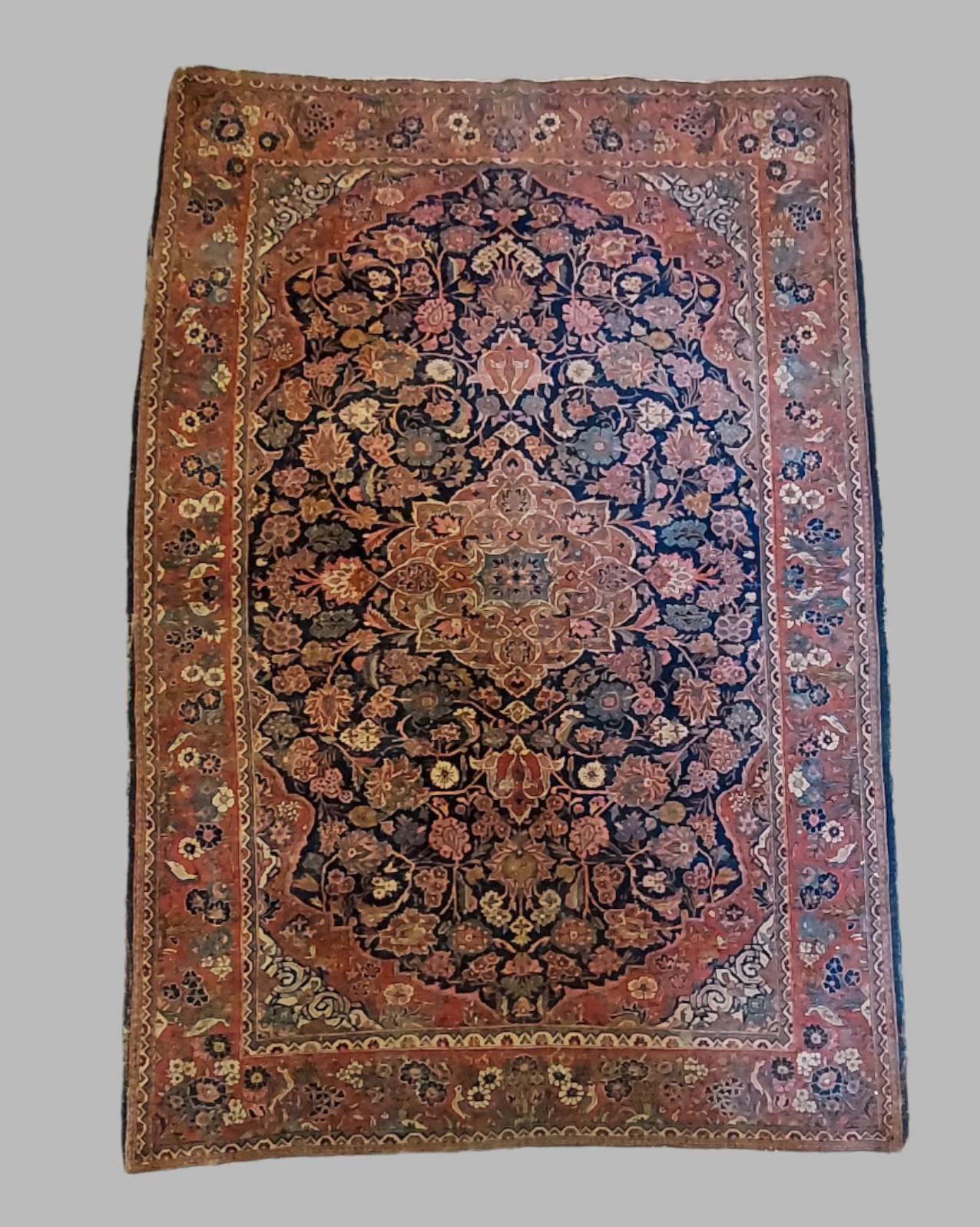 A North West Persian woollen rug with all over design within multiple boarders, 200cm by 135cm