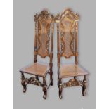 A pair of 19th Century oak Charles II style side chairs, each with a pierced carved and partly caned