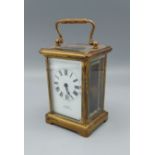 A brass cased carriage clock retailed by J. C. Vickery Regent Street, 11.5cms tall