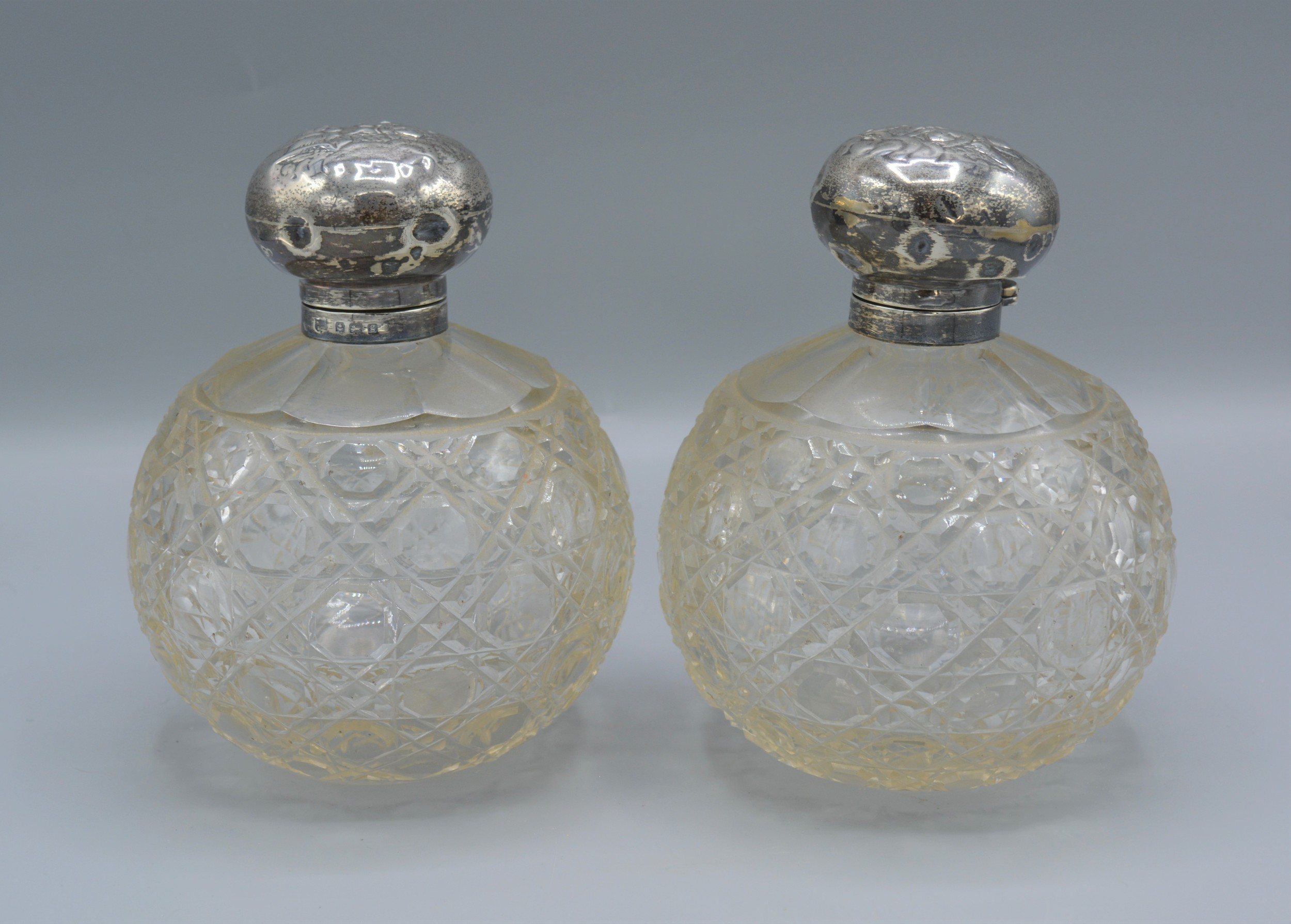 A pair of Edwardian silver and cut glass large scent bottles, decorated with whispers, Birmingham - Image 2 of 2
