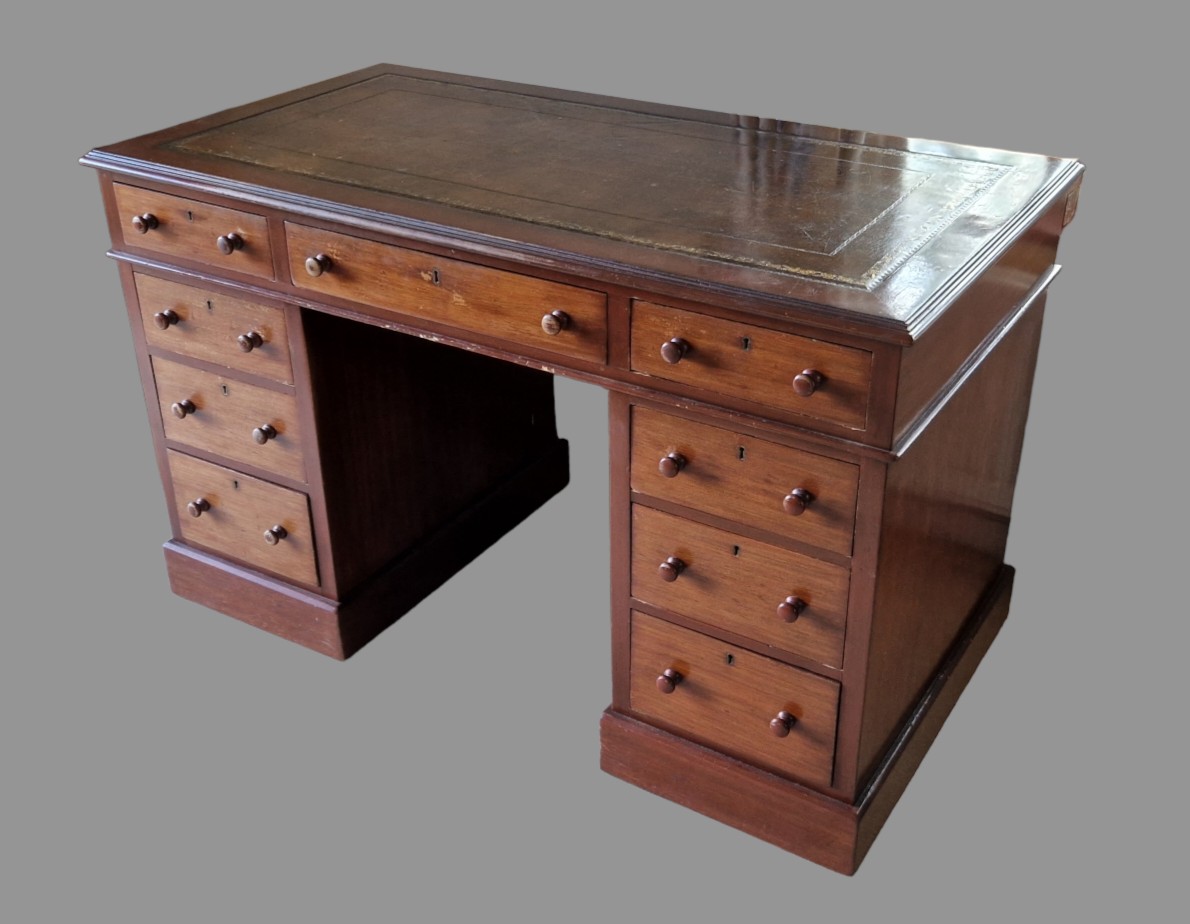 A Victorian mahogany twin pedestal desk, the tooled leather inset top above nine drawers with knob