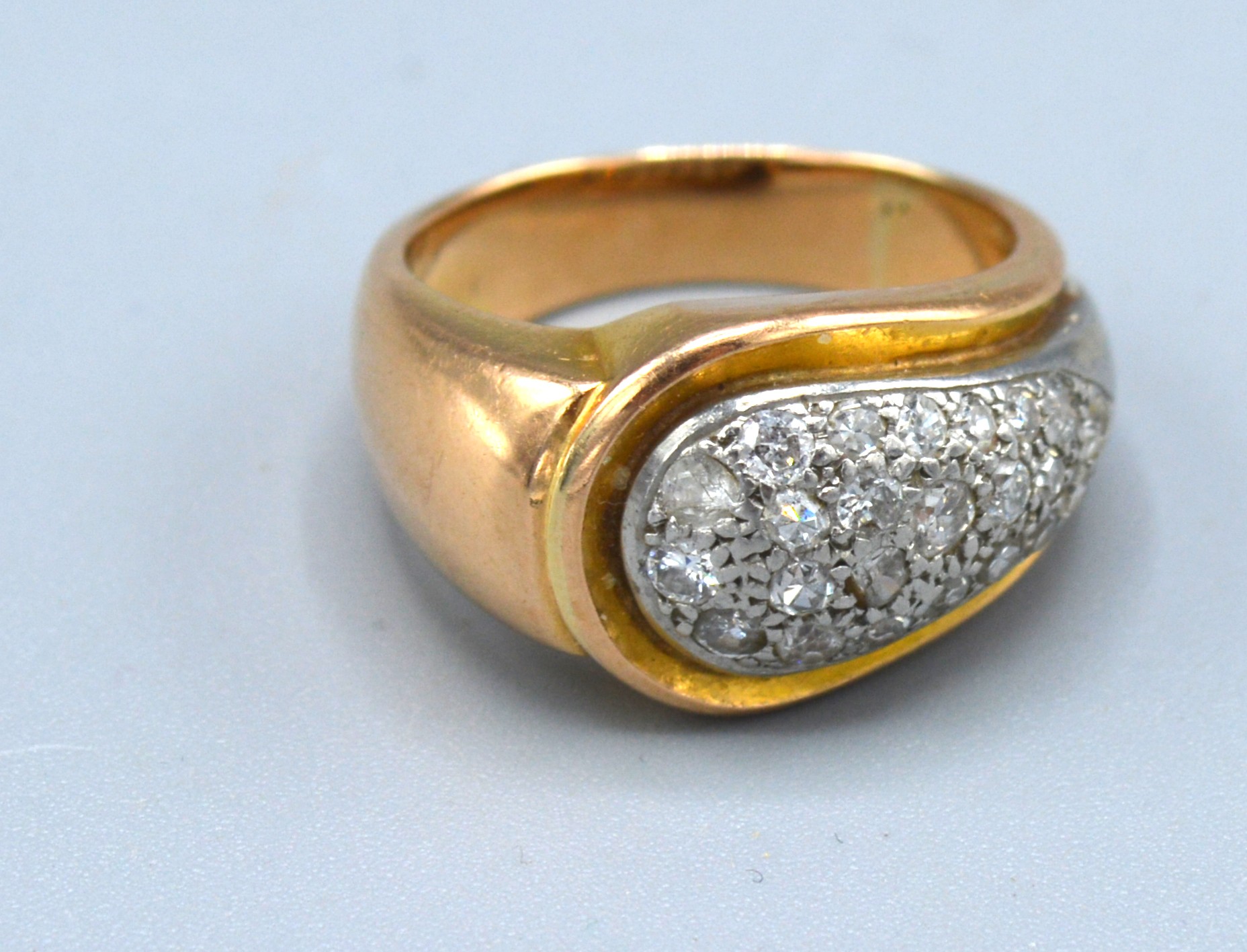 An 18ct. Yellow Gold Diamond Ring of shaped form, 9.2gms. ring size L