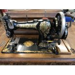 Antique Jones Shuttle Sewing Machine Family C.S, cased with key, very attractive black, red and gold