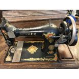 Antique Singer Sewing Machine serial number F6633502 circa 1915 black with red green and gold