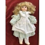 Porcelain doll, long hair, with porcelain head, hands feet, fabric body arms & legs. Vintage
