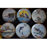 A set of 12 Fisherman humorous porcelain wall plates with plastic hanging fittings. A nice set of "