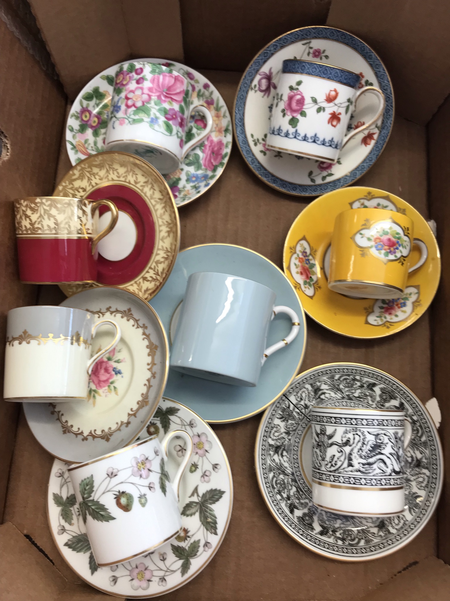 8 different Miniature bone china coffee cups and saucer sets (one Wedgwood saucer is very cracked)