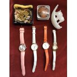 Jewellery collection including (4) wrist watches, necklaces, pendants a faux jade elephant paper