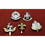 British Military Cap Badges (5) including: The Suffolk Regiment Non Voided Economy Issue Cap Badge