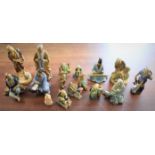 Chinese and Japanese ceramic figurines (16) depicting many figures working. A nice collection,