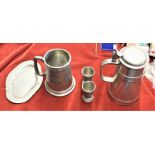 German Pewter Beer mugs (2), a pewter plate and two pewter shot vessels.