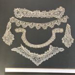 A group of fine, possibly Irish, 19th century bobbin lace pieces of collars, trim and inserts.