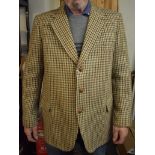 Harris Tweed jacket made by Dunn & Co. Two large flapped hip pockets and one chest pocket. Three