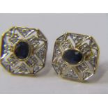 PAIR OF 9ct YELLOW GOLD SAPPHIRE & DIAMOND STUD EARRINGS, principal oval cut sapphires surrounded by