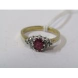 9ct YELLOW GOLD RUBY & DIAMOND RING, principal oval cut ruby with accent brilliant cut diamonds to
