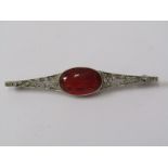 UNUSUAL BROOCH WITH WHITE METAL DIAMOND & RED/ORANGE STONE (POSSIBLY SPINELL), In fitted box by