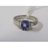 18ct WHITE GOLD TANZANITE & DIAMOND RING, principal oval cut tanzanite with rectangular cut diamonds