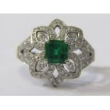 18ct WHITE GOLD EMERALD & DIAMOND CLUSTER RING, Principal modified princess cut emerald of good