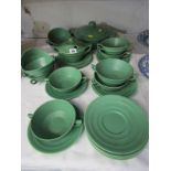 KEITH MURRAY - STYLE WEDGWOOD, matt green glazed tureen, 11 soup bowls, 12 saucers, sauce tureen and