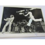 THE WHO, an early concert photograph of Roger Daltrey, Pete Townsend & Keith Moon, signed by the