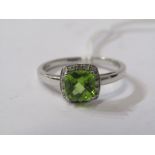 9ct YELLOW GOLD PERIDOT & DIAMOND RING, principal cushion cut peridot surrounded by a halo of accent