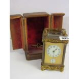 HARRODS CARRIAGE CLOCK, attractive serpentine fronted brass cased bevel glass carriage clock with