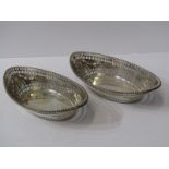 PAIR OF SILVER SWEETMEAT DISHES, oval bodied pierced edge and swag embossed sweet meat dishes,