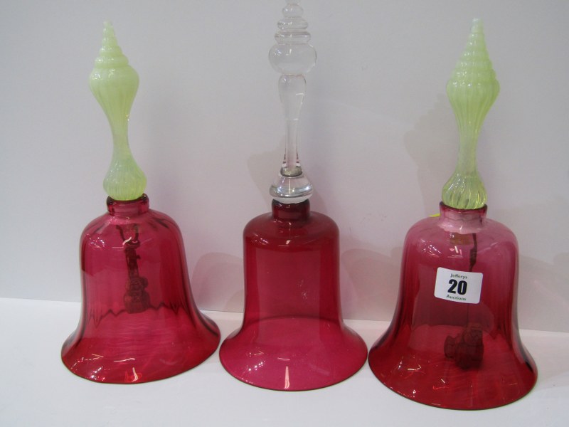 ANTIQUE GLASSWARE, pair of cranberry glass vaseline handled table bells, 26cm height and 1 similar