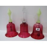 ANTIQUE GLASSWARE, pair of cranberry glass vaseline handled table bells, 26cm height and 1 similar