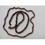 2 AMBER STYLE NECKLACES, 1 bead, other ruff cut