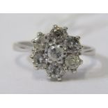 18ct WHITE GOLD 7 STONE DIAMOND DAISY STYLE RING, bright diamonds of good colour totalling in excess