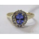 14ct YELLOW GOLD TANZANITE & DIAMOND CLUSTER RING, principal oval cut tanzanite surrounded by