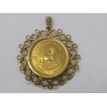KRUGERRAND COIN PENDANT, 1974 full Krugerrand in heavy 9ct yellow gold pendant setting, approx 45.