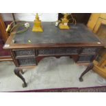 GEORGIAN DESIGN KNEEHOLE DESK, carved mahogany desk with blind fretwork drawer fronts, stamped "