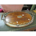 EDWARDIAN SERVING TRAY, oak oval twin handled tray with ornate silver plate surround and engraved