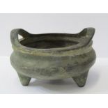 EASTERN METALWARE, a signed bronze twin handled temple incense bowl, inset cast character base, 15cm