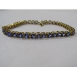 9ct YELLOW GOLD TANZANITE TENNIS STYLE BRACELET, approx 7.5" length