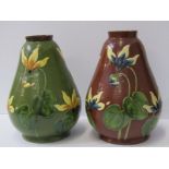 CONTINENTAL POTTERY, 2 slip glaze 20cm vases decorated with relief cyclamen