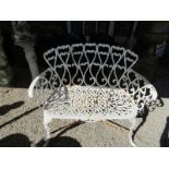 GARDEN FURNITURE, a cast metal 2 seater bench with ornate batton seat panel, 96cm width