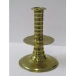 EARLY METALWARE, 17th century brass circular based 14cm candlestick with ribbed stem